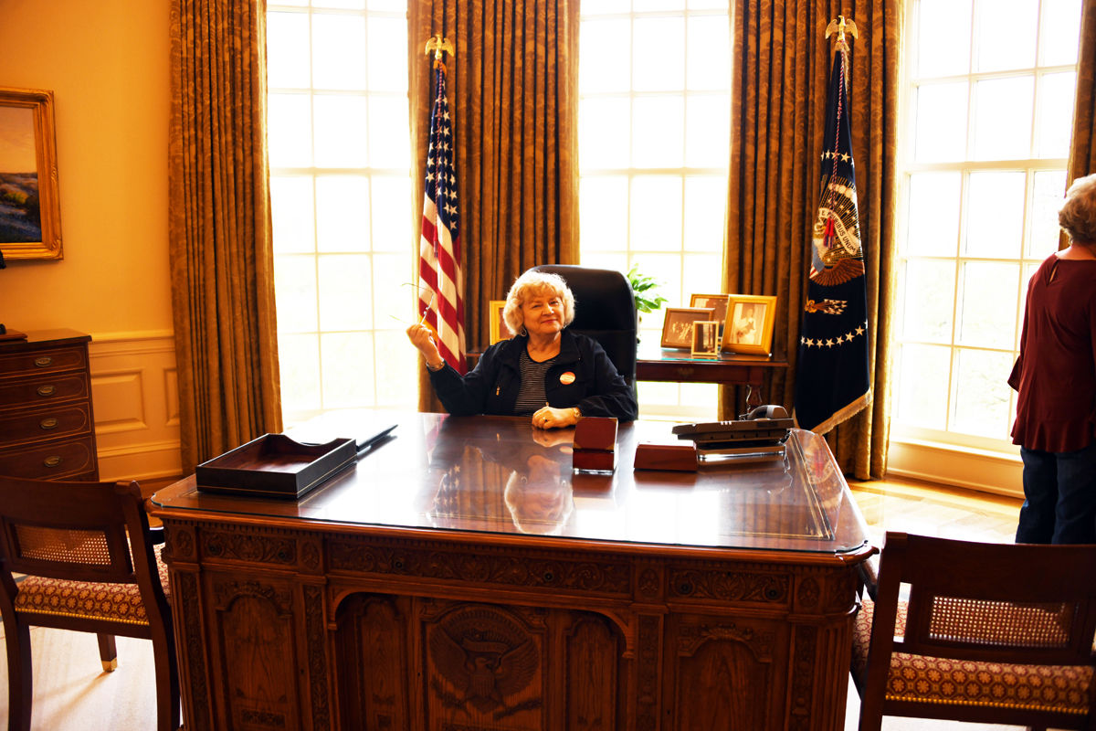 306 Bernice Mettenbrink at George W Bush's desk in the re-created Oval Office.JPG